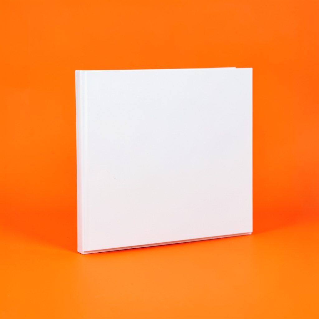 An open book template with reading exercises, clean layout on a light desk surface.